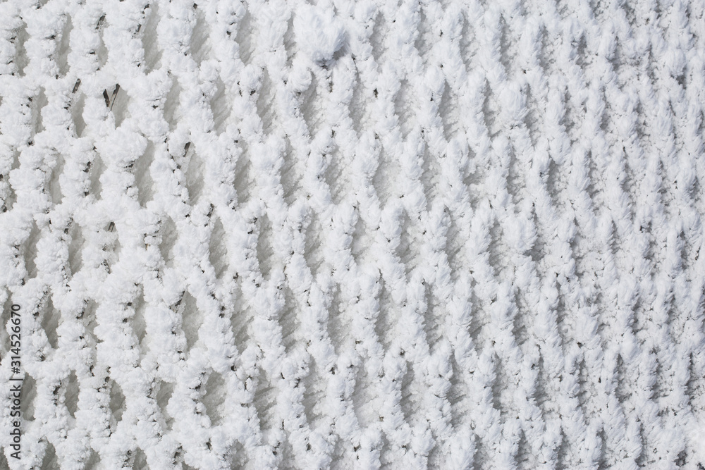 winter background with snow texture closeup. Lattice winter background with snow texture closeup. Lattice