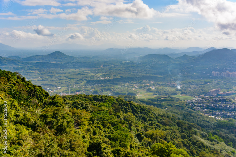 Panoramic view to mountains, tropical forest, Yanoda Park and Sanya city. Rainforest cultural tourism zone Yanoda, Hainan island, Yalong Bay Tropical Paradise Forest Park. China.