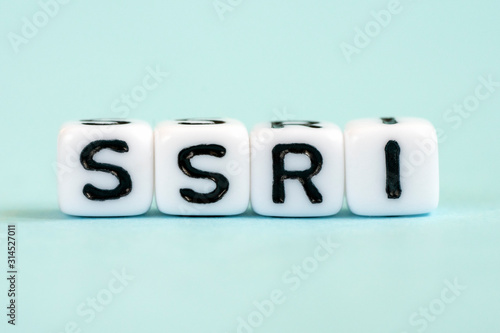 SSRI - selective serotonin reuptake inhibitors, inscription on blocks. Medical concept. photo