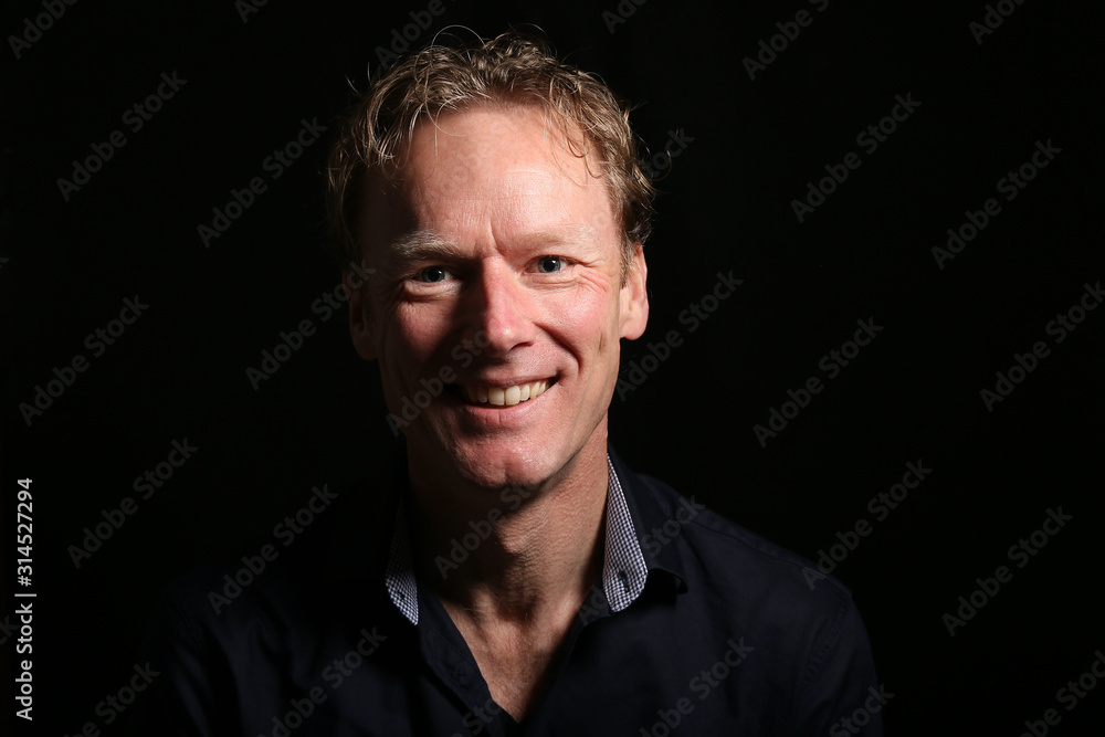 Fototapeta premium Beautiful man in front of a background
