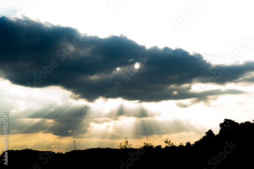 Light penetrates the clouds of sunset