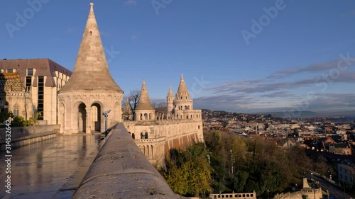 Towers of the Fisherman's Bastion against the background of a dawn sky. Budapest, Hungary photo