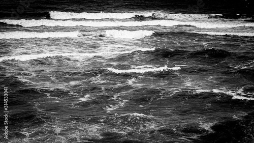 Large ocean waves crashing  on a sunny day. Taken in Portugal.