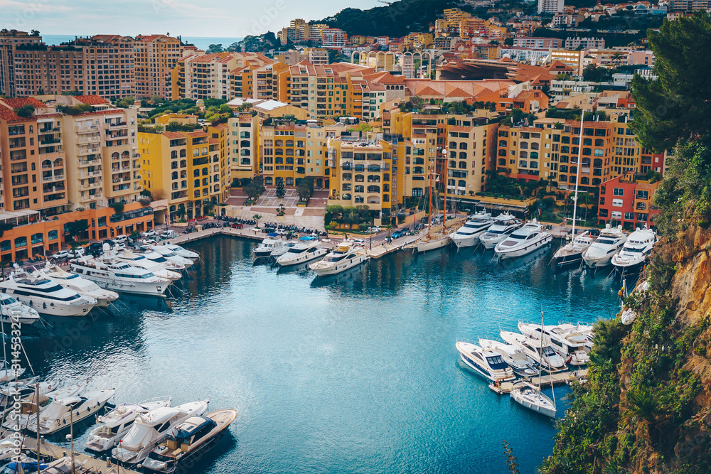 Aerial view of Monaco port. Port Fontvieille, Monaco Ville, topview from Monaco Ville, azure water, harbor, luxury apartments, yachts. view of yachts in Port Hercules, Monaco.