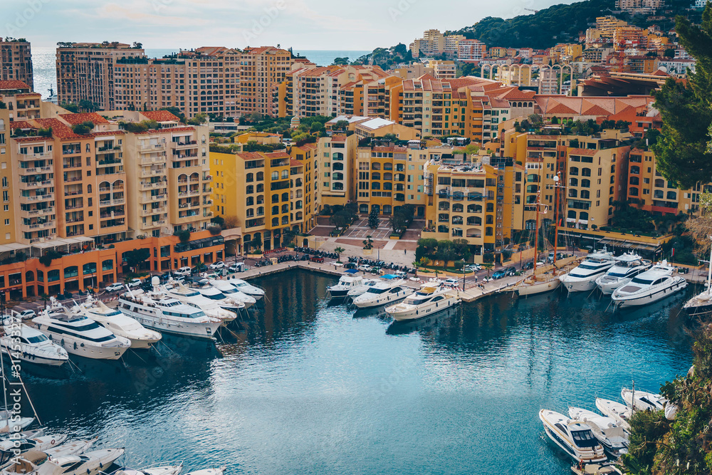 Monaco Fontvieille cityscape of French Riviera. topview from Monaco Ville, azure water, harbor, luxury apartments, yachts. Port Fontvieille.