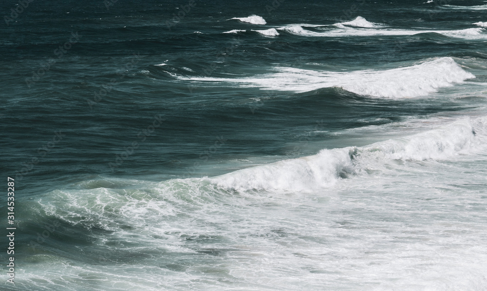 Large ocean waves crashing, on a sunny day. Taken in Portugal. Large ocean waves crashing, on a sunny day. Taken in Portugal.