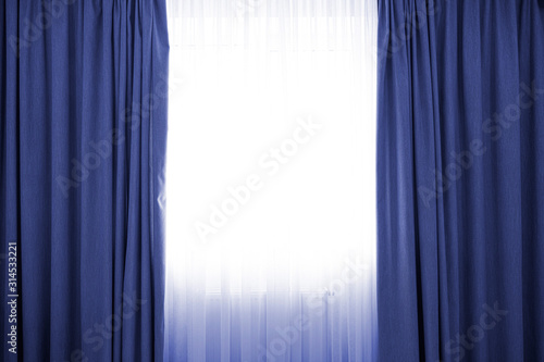 Classic blue color curtains with a copy space in the middle