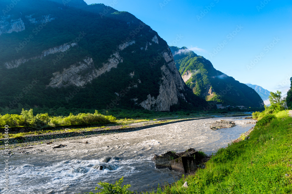 High green mountains of the Caucasus, view of the fast river, Georgia