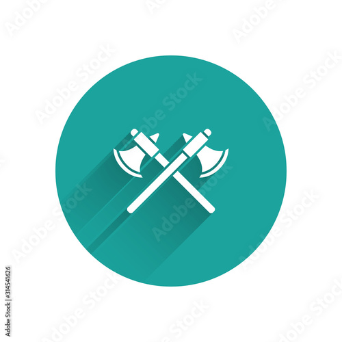 White Crossed medieval axes icon isolated with long shadow. Battle axe, executioner axe. Green circle button. Vector Illustration