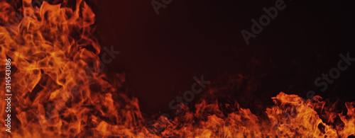 Panoramic view fire on isolated black background. Perfect flames texture overlays for copy space.