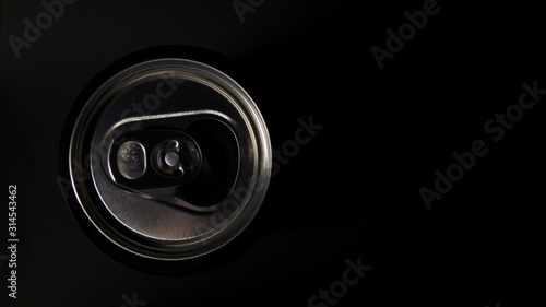 Aluminum can on black background. Fresh drink. Interior poster. View from above.