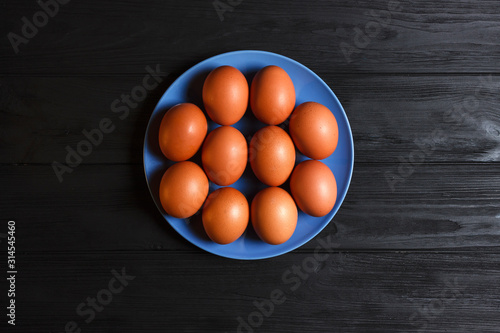 eggs in bowl on wooden table