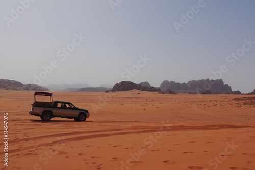 off-road vehicle (four wheel drive), ready for desert safari in famous Wadi Rum. UNESCO world heritage site known as the Valley of the Moon