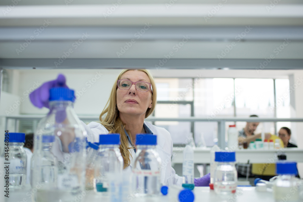 Laboratory scientist researching chemical compositions Laboratory scientist researching chemical compositions