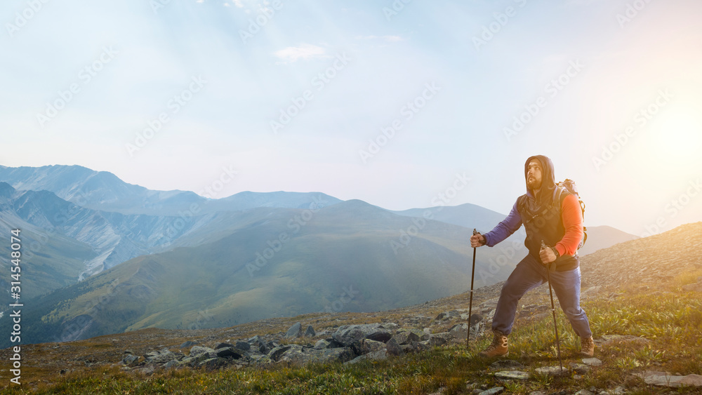Obraz premium Hiker man in mountains. Mixed media