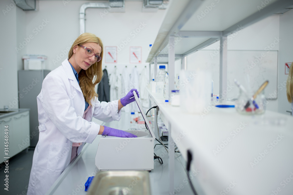 Laboratory scientist researching chemical compositions Laboratory scientist researching chemical compositions