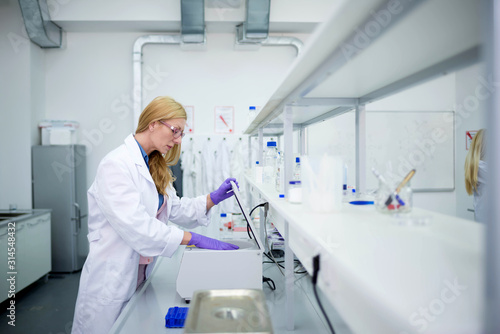 Laboratory scientist researching chemical compositions