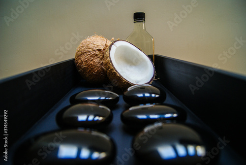 coconut, massage, sand, oil, coconut oil, obsidian, rocks, hot stones, alternative therapies, relaxation, meditation, decoration, interior, fruits, sea, beach, bottle, glass,