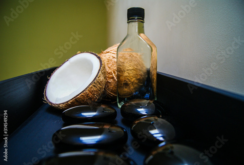 coconut, massage, sand, oil, coconut oil, obsidian, rocks, hot stones, alternative therapies, relaxation, meditation, decoration, interior, fruits, sea, beach, bottle, glass,