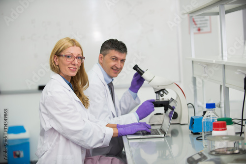 Laboratory scientists researching chemical compositions