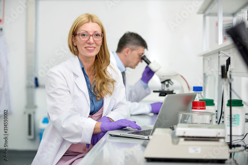 Laboratory scientists researching chemical compositions