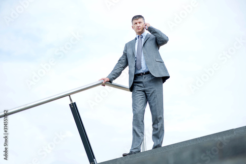 Businessman out of the office talking on his phone