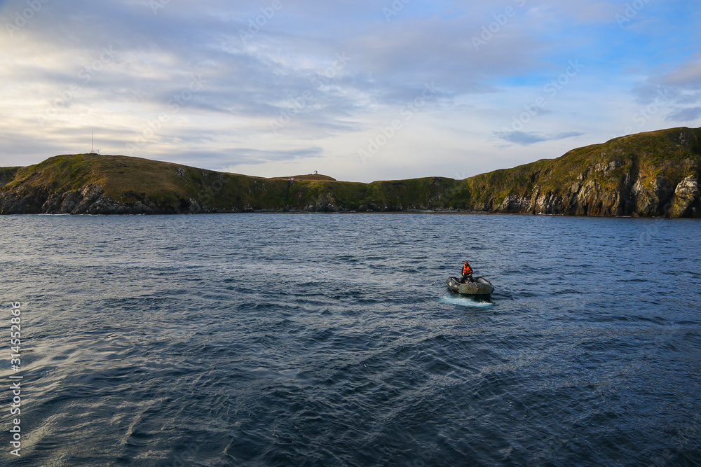 Inflatable dinghy in front of Cape Horn Island in Chile