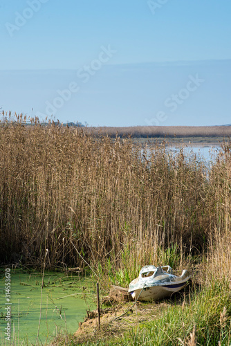 small abandoned boat in the nature reserve of Esmoriz, Portugal photo