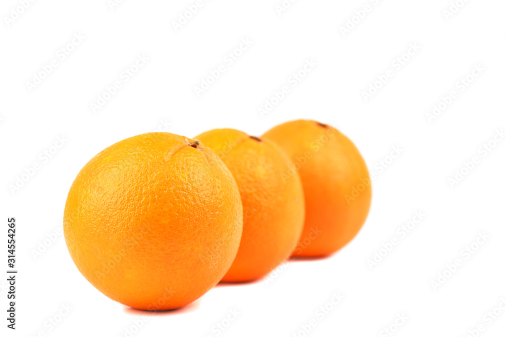 Three ripe oranges isolated on white background. Three ripe oranges isolated on white background.