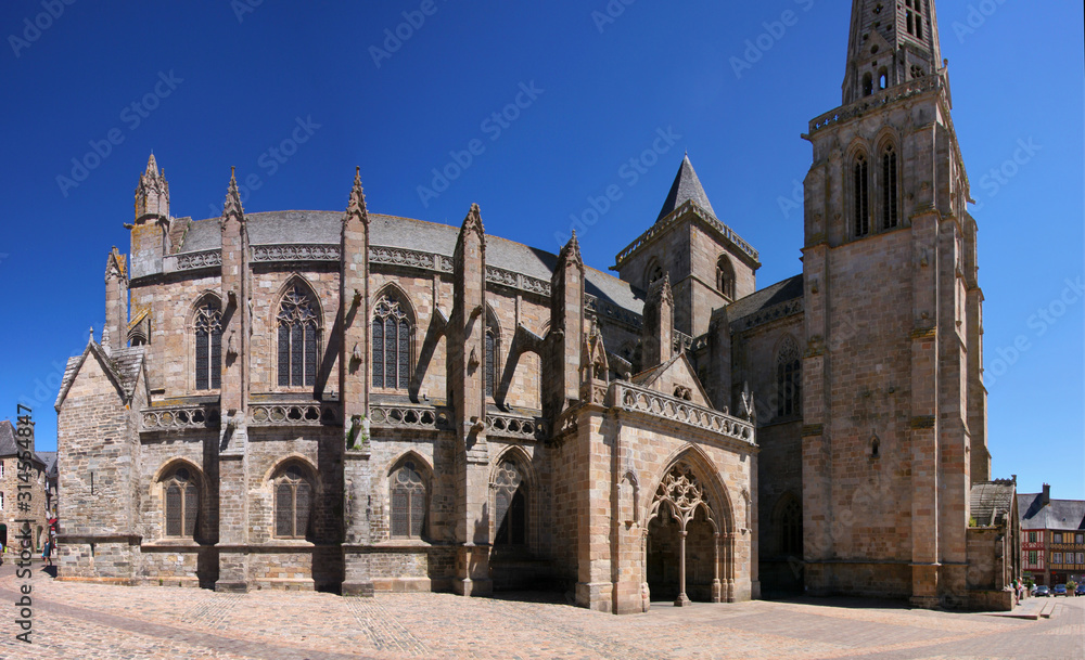 Panoramic view of the gothic cathedral with buttresses on its facade in the old town of Tréguier in France