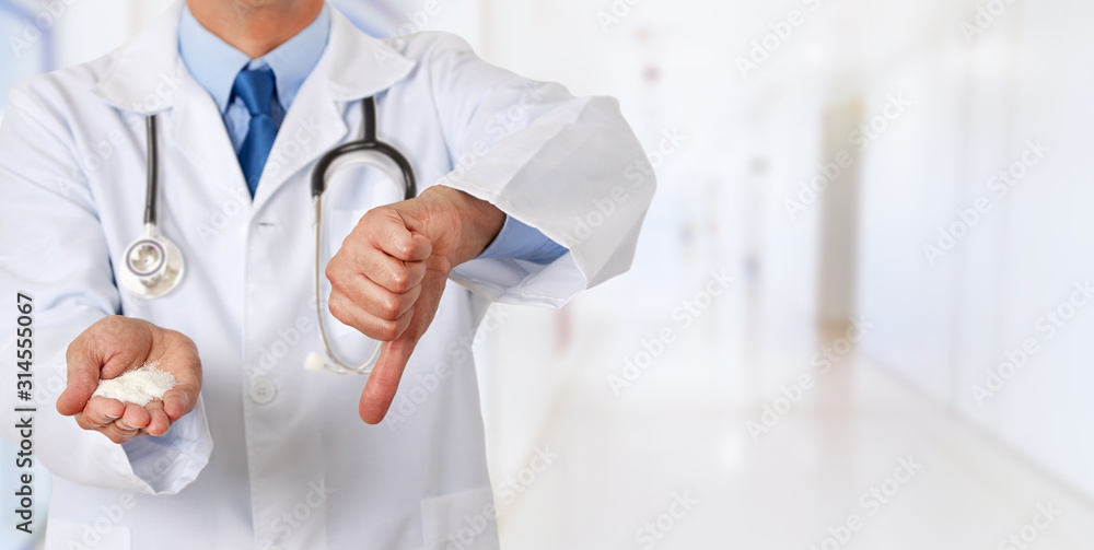 doctor hand holding sugar with thumb down doctor hand holding sugar with thumb down