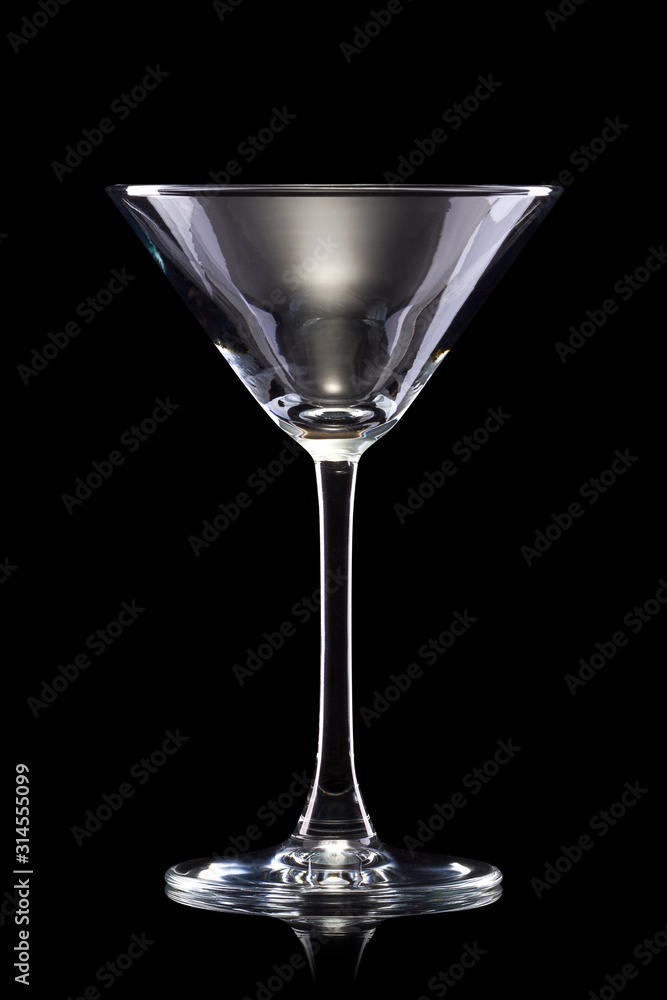 Empty red martini glass isolated on a black background