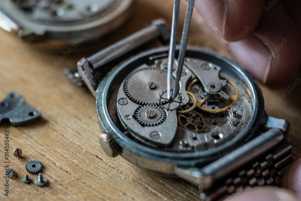 Watchmaker is repairing the wristwatch, mechanical watch Watchmaker is repairing the wristwatch, mechanical watch