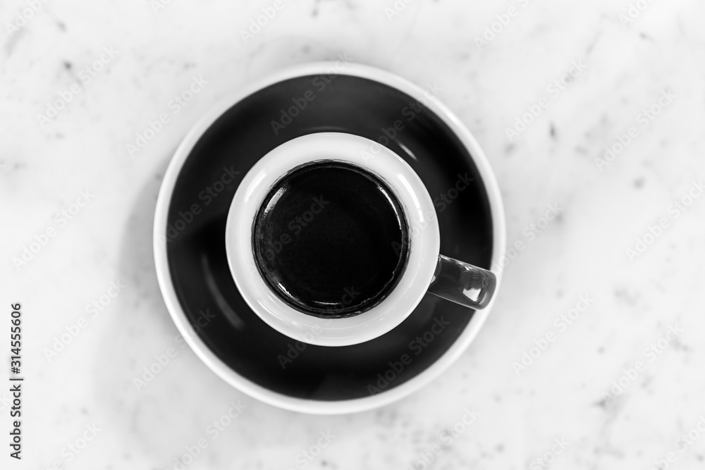Cup of espresso  on a table, top view