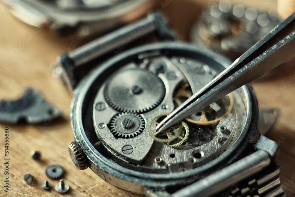 Fototapeta premium Watchmaker is repairing the wristwatch, mechanical watch