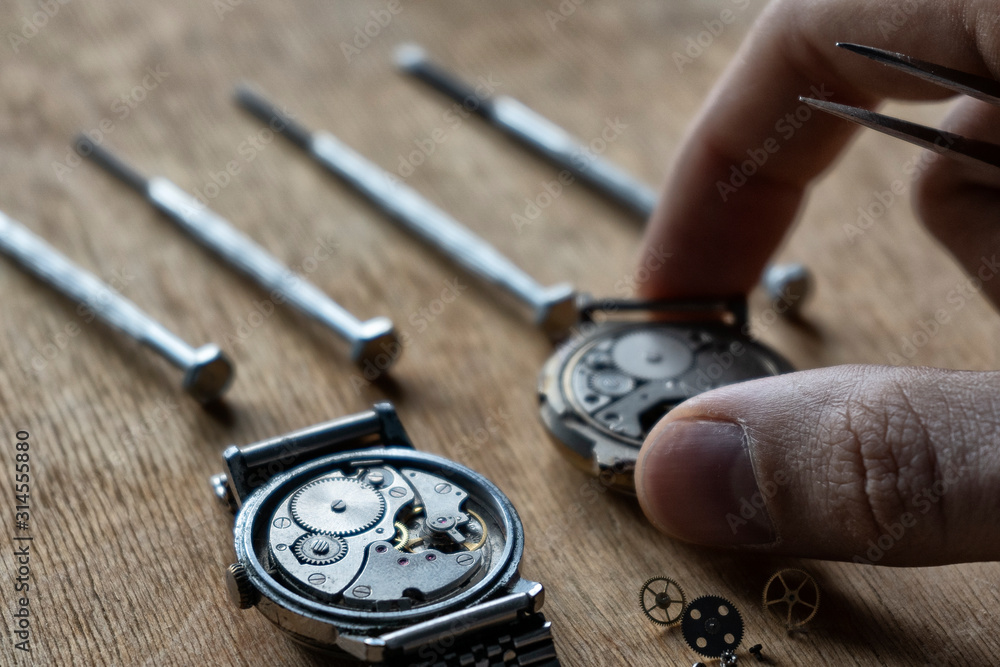 Watchmaker is repairing the wristwatch, mechanical watch Watchmaker is repairing the wristwatch, mechanical watch