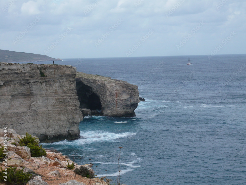 Rugged cliffed coast line rising hundreds of feet above sea level along Maltese archipelago of the Mediterranean, Sea,  Malta - Facing acrophobia 