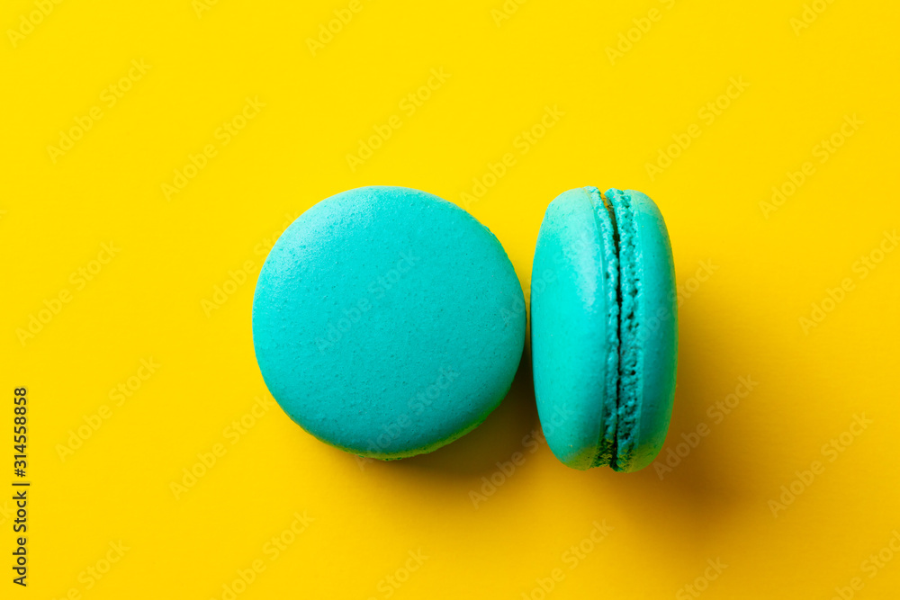 Macaroons dessert on yellow background. Close up. Top view. Macaroons dessert on yellow background. Close up. Top view.