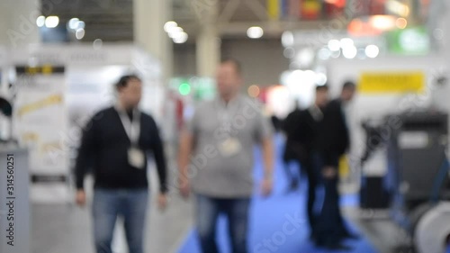 Abstract Defocused Blurred Background flow of many people inside