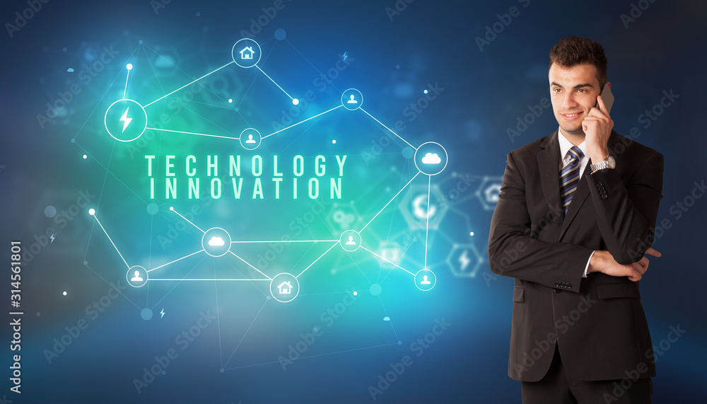Businessman in front of cloud service icons with TECHNOLOGY INNOVATION inscription, modern technology concept Businessman in front of cloud service icons with TECHNOLOGY INNOVATION inscription, modern technology concept