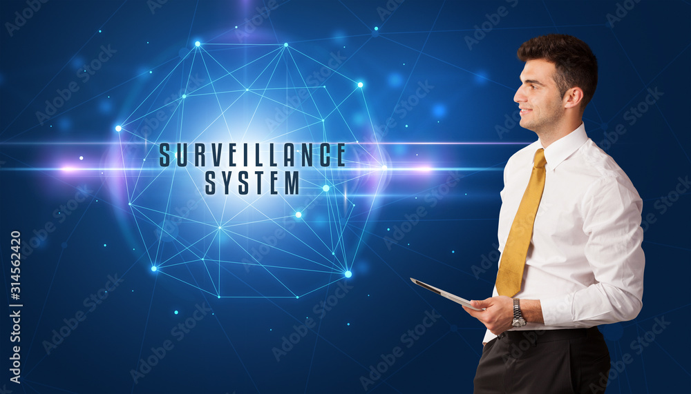 Businessman thinking about security solutions with SURVEILLANCE SYSTEM inscription Businessman thinking about security solutions with SURVEILLANCE SYSTEM inscription