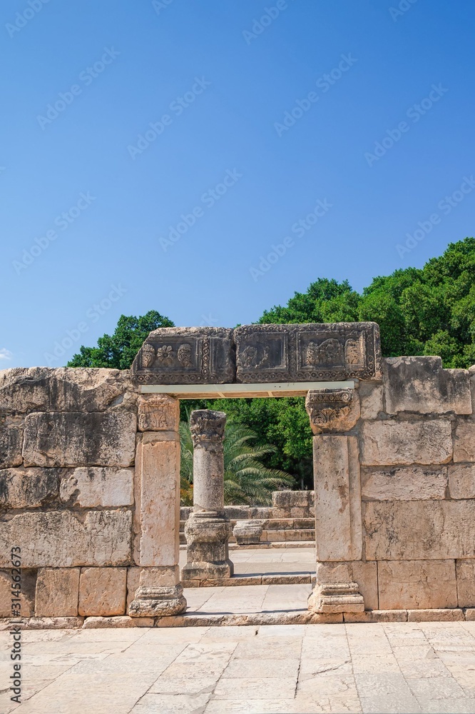 Remains of a Synagogue in the old fishing village Capernaum, Israel. Blue sky, sunny day