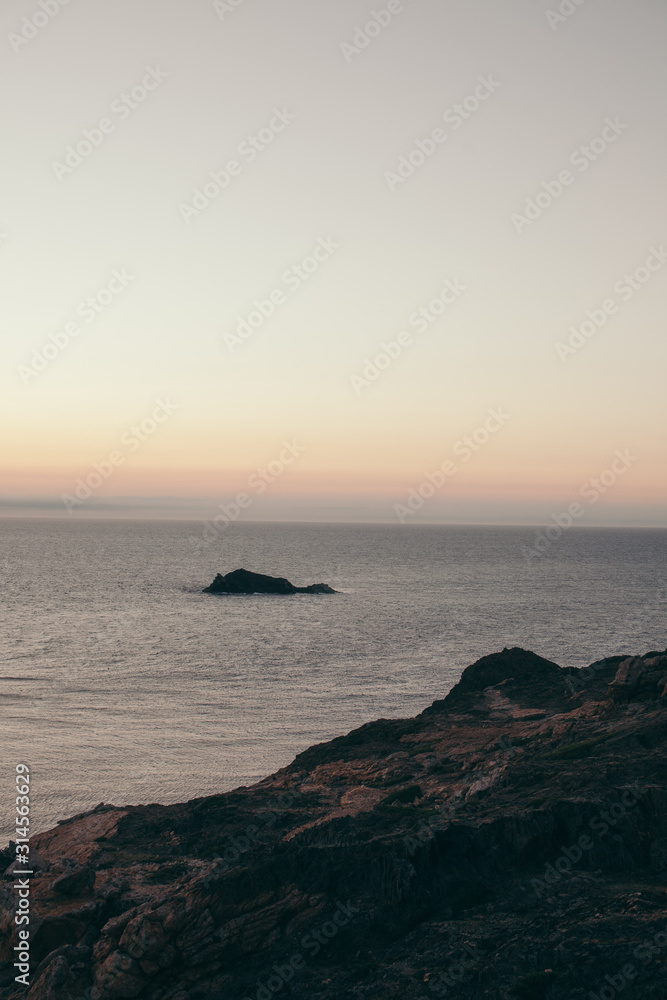 sea bay with rocks at sunrise