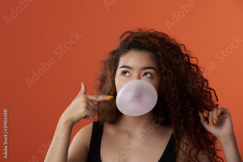 Teenager girl with bubble gum