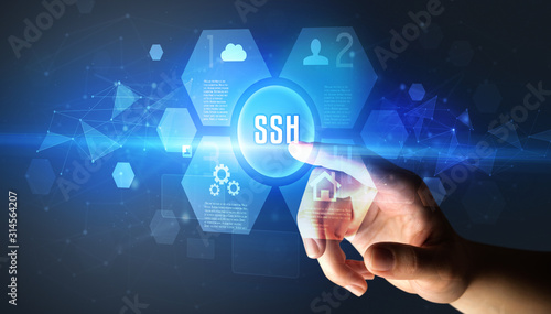 Hand touching SSH inscription, new technology concept