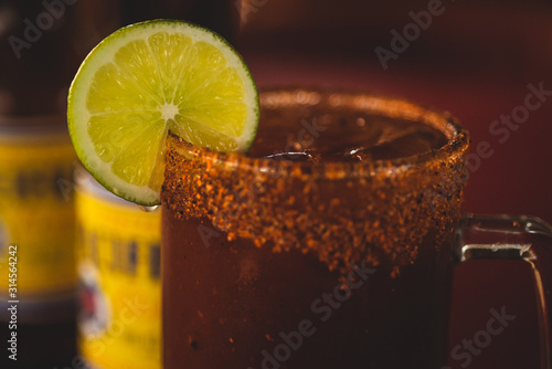 San Jose Del Cabo, Los Cabos, Mexico / Apr 2019 Michelada is a Mexican cerveza made with beer, lime juice, assorted sauces (often chili-based), spices, tomato juice, salt and chili peppers. 
