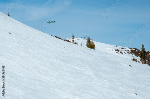 Helicopter over snow resort - emergency airlift