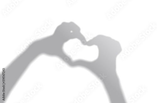 Wallpaper Mural Concept modern abstract background of shadow heart frame in hand on a white wall. White and Black for overlaying a valentine photo or mockup Torontodigital.ca