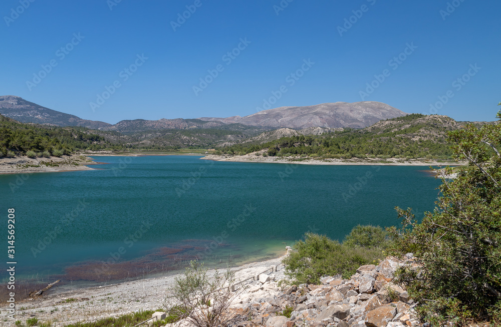 Scenic view dammed lake Limni Apolakkias at Greek island Rhodes