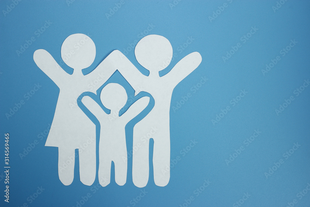 A family cut out of paper. The concept of happiness A family cut out of paper. The concept of happiness